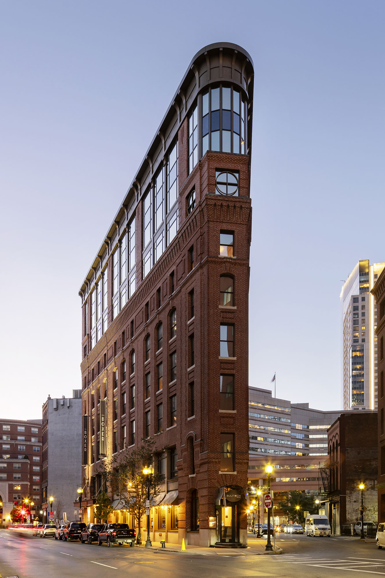 The triangular 1904 flatiron building of Eurostars The Boxer in the Bulfinch Triangle at dusk