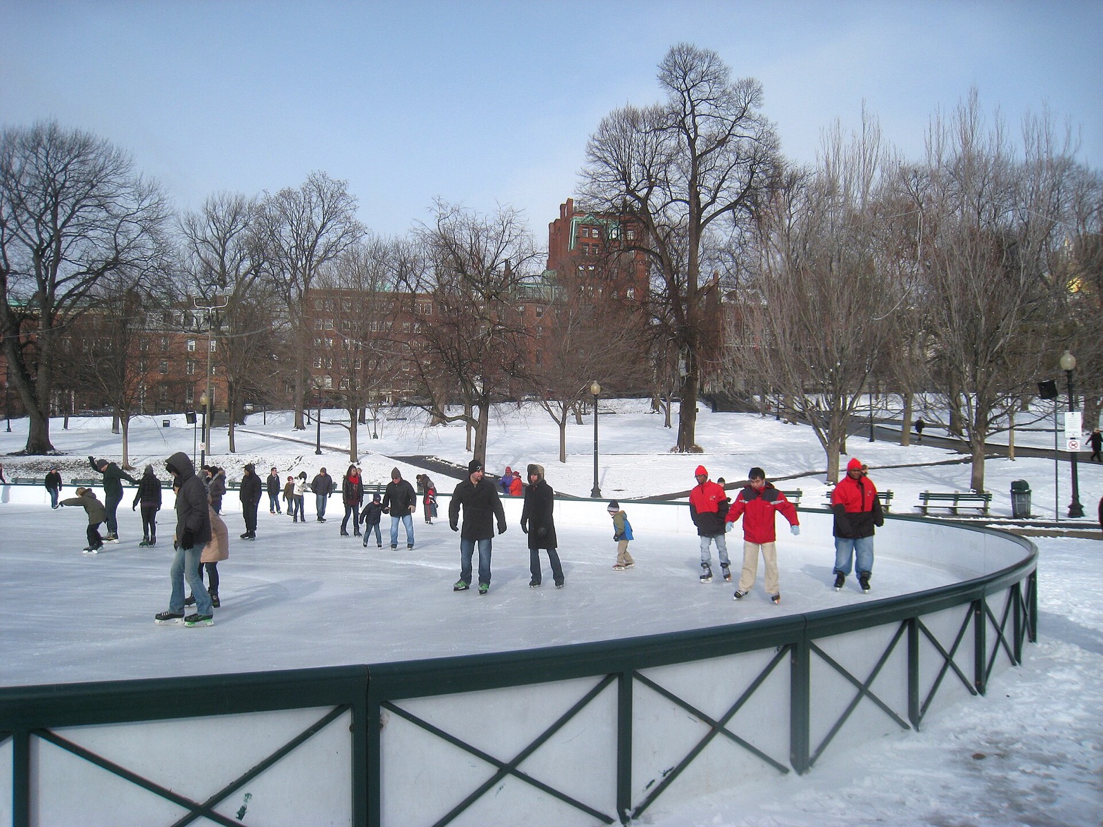Skaters on the Frog Pond rink on Boston Common in December